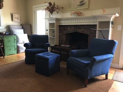 Chairs on either side of fireplace